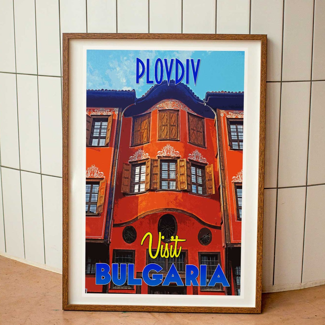 Wood-framed vintage travel poster print featuring the vibrant cityscape of Plovdiv, Bulgaria, exemplifying the charm and appeal of emerging travel destinations worldwide