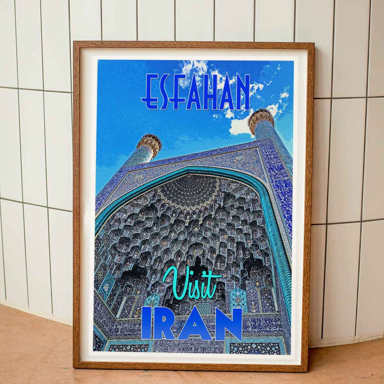 Wood-framed vintage travel poster print featuring the awe-inspiring Shah Mosque in Esfahan, Iran, symbolizing the beauty and charm of emerging travel destinations worldwide.